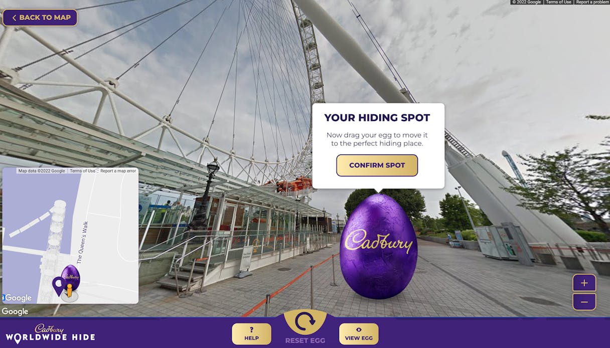 Google Street View beside the London Eye with a purple Cadbury egg and a prompt to drag it to a hiding spot, Worldwide Hide for Cadbury