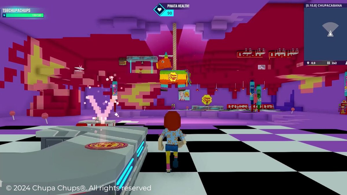 Chupa Chups City in The Sandbox: a blocky avatar runs across a black and white checked floor towards a rainbow Chupa Chups piñata hanging in a purple and red hall, with a Pinata Health counter at the top