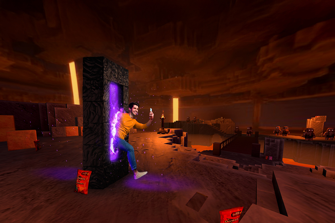 Promotional image for Doritos' Enter The Nether Lands: a man holding up a phone steps out of a glowing portal into a lava cavern, with Doritos bags on the ground