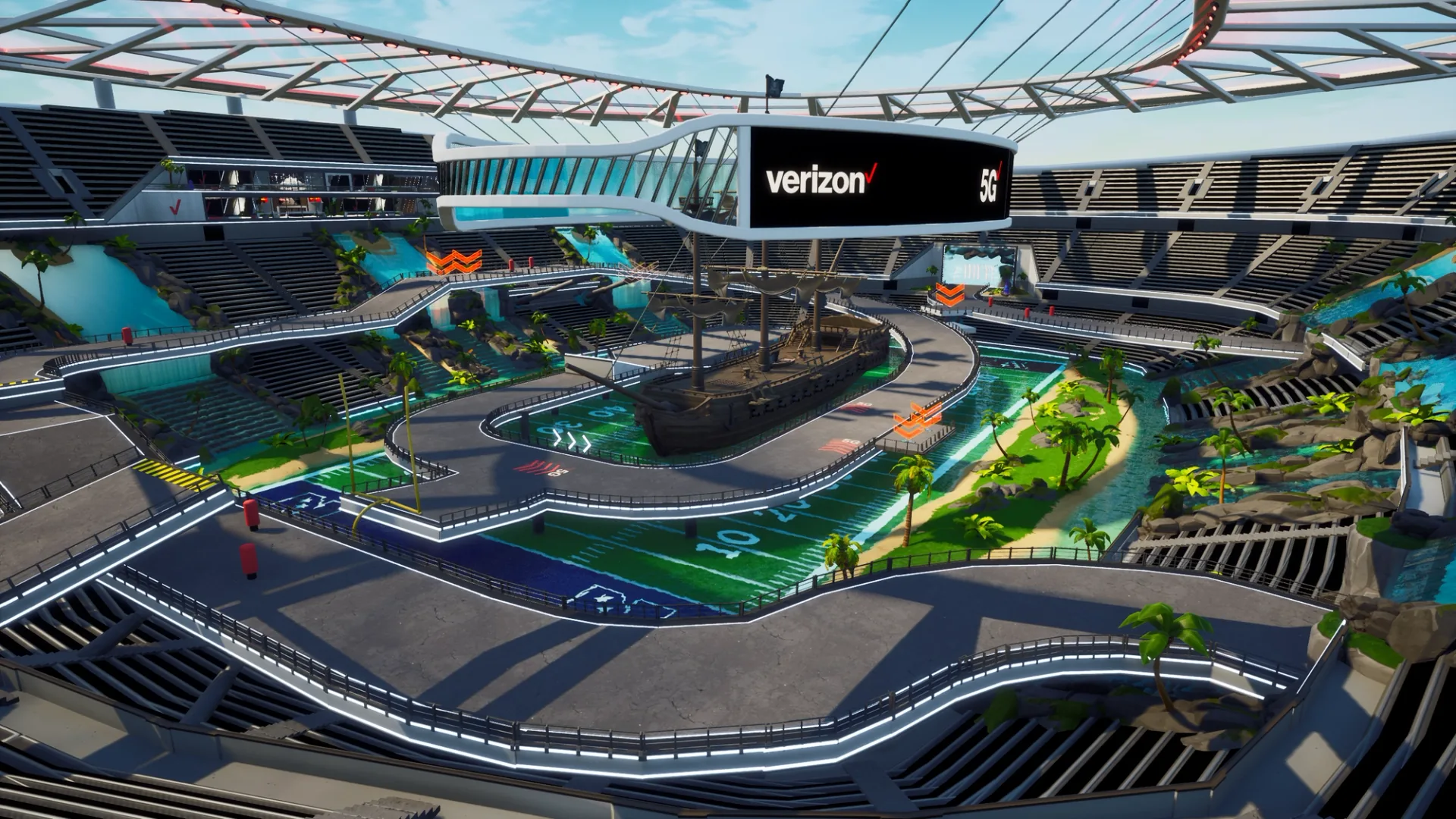 Verizon 5G Stadium in Fortnite: a pirate ship sits over a football field inside the stadium, circled by a raised track, palm beaches and waterfalls in the stands, under a Verizon 5G screen
