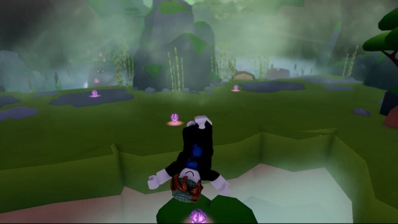 An upside-down Roblox avatar over a misty meadow dotted with purple crystals in Warner Bros.' Godzilla X Kong Obby