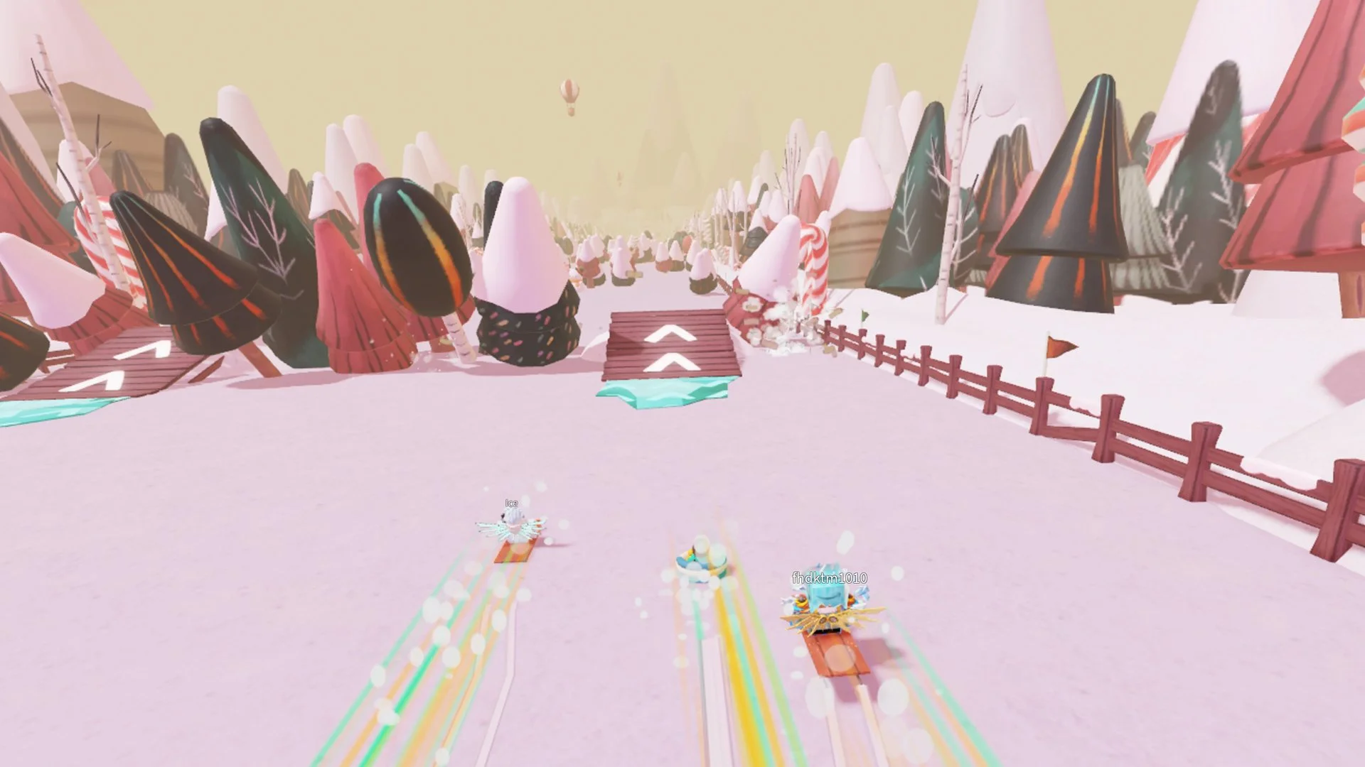 Roblox players race sleds down a pink snowy slope past ramps and candy canes in Amazon's Holiday Dash