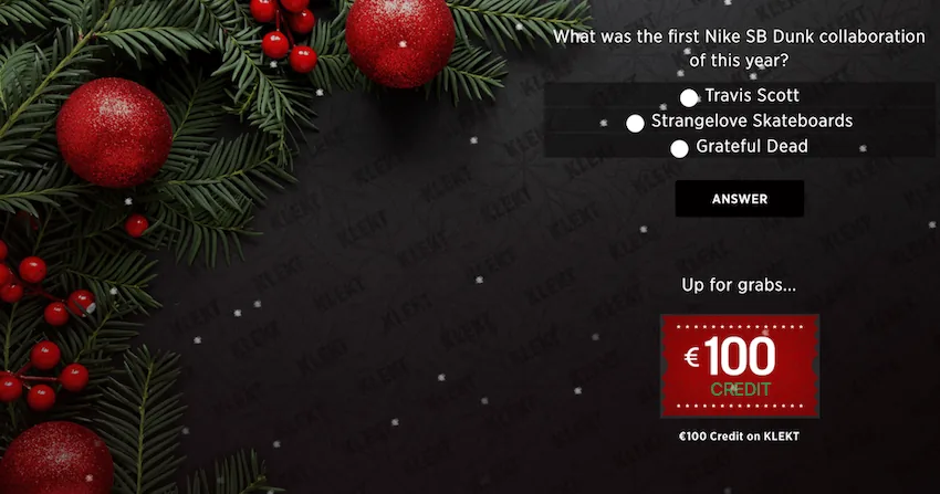 Klekt's Holiday Kalendar: a quiz screen asking What was the first Nike SB Dunk collaboration of this year? with three answers and an Answer button, a €100 Credit on KLEKT prize ticket, and red baubles on fir branches