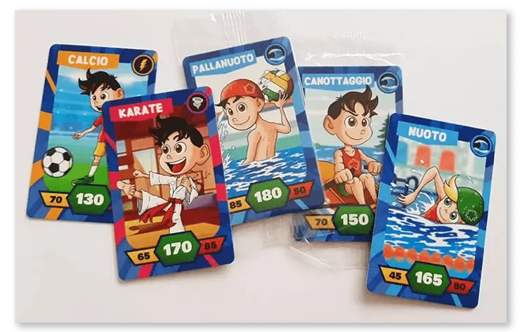 Golocard for Negroni: five printed sport cards, Calcio, Karate, Pallanuoto, Canottaggio and Nuoto, each with a cartoon athlete, an element icon and score numbers, lying on a clear wrapper