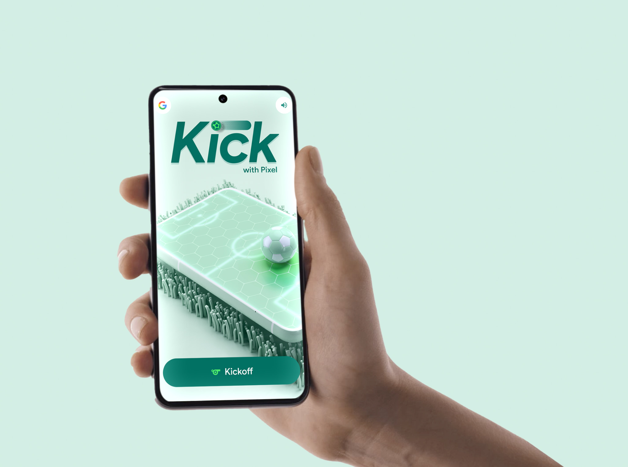 A hand holds a phone showing Google's Kick With Pixel start screen, with a mint pitch, ball and Kickoff button.