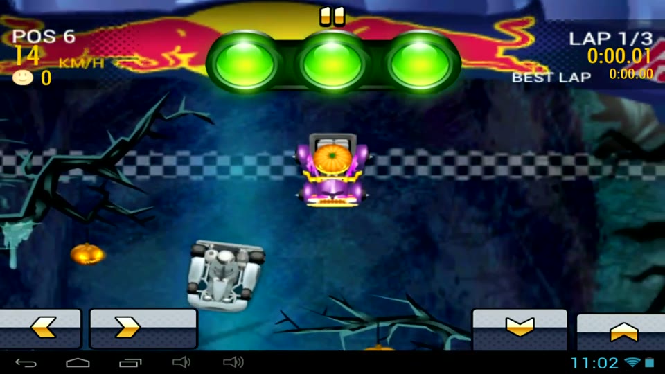 Kart Fighter 3 for Red Bull on Android: two karts at a chequered start line on a dark track with pumpkins and bare trees, three green start lights in front of the Red Bull logo, and the screen shows position 6 and lap 1/3
