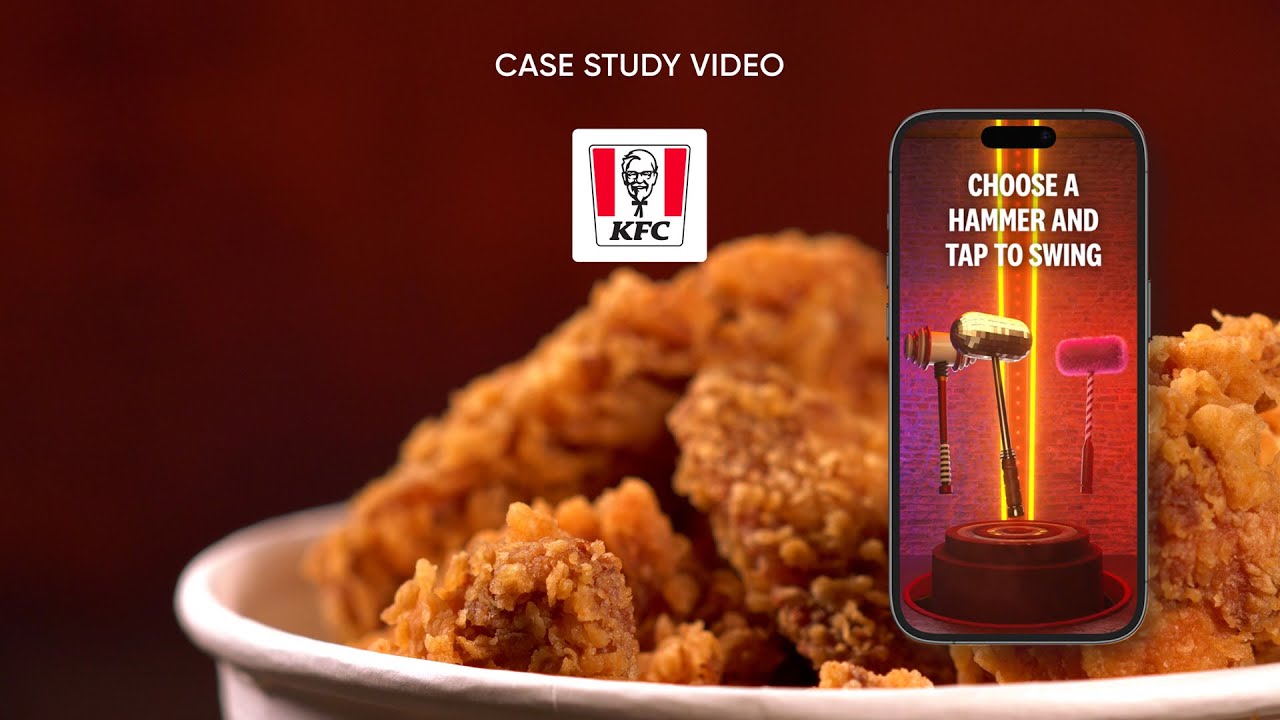 A phone in front of fried chicken shows three hammers and a tap-to-swing prompt in KFC's Rewards Arcade
