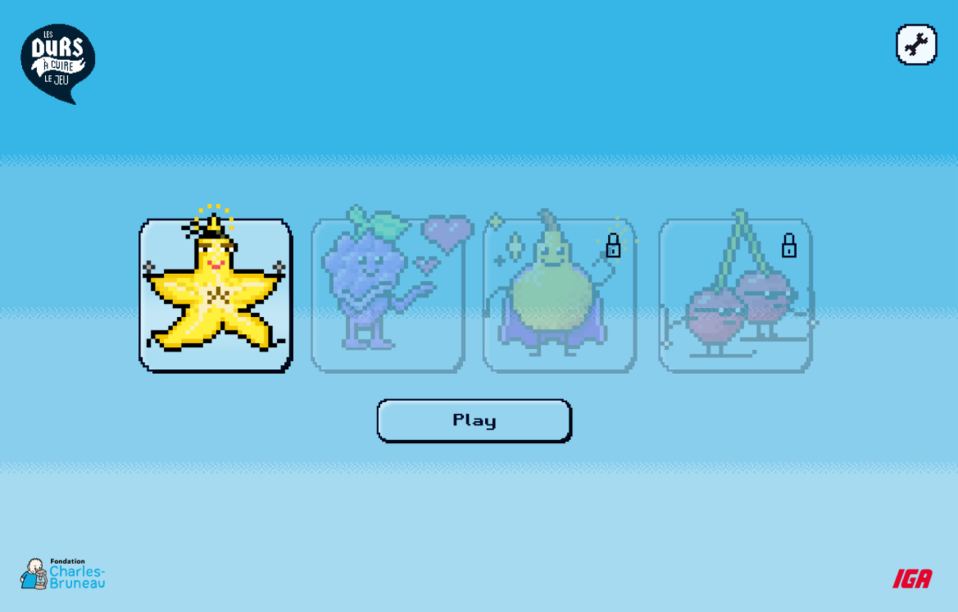 Character select screen in Tough Cookies: The Game for IGA: a pixel-art star character is selected while a grape, a pear and a pair of cherries are greyed out, two with padlocks, above a Play button and the Fondation Charles-Bruneau and IGA logos