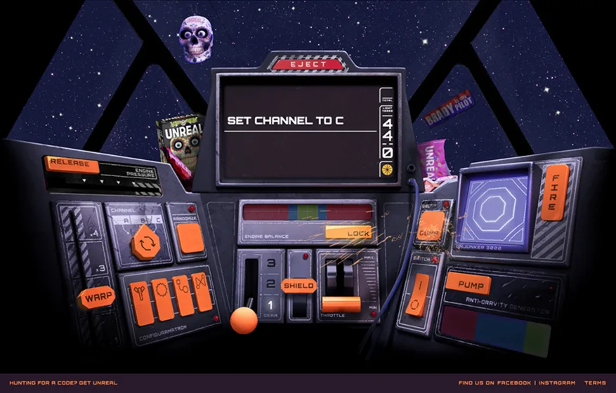 Spaceship cockpit in Unreal Mission, its screen reading Set channel to C, with Unreal packs floating outside